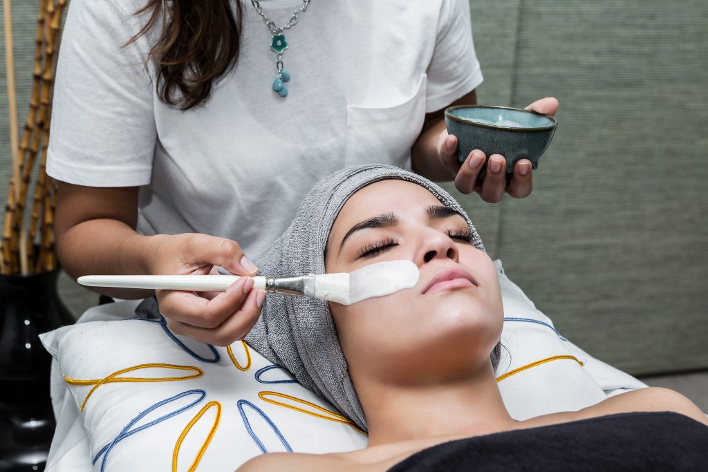 Someone getting a facial treatment at a spa